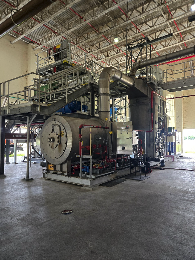 Large industrial dryer package installed inside a fabrication facility